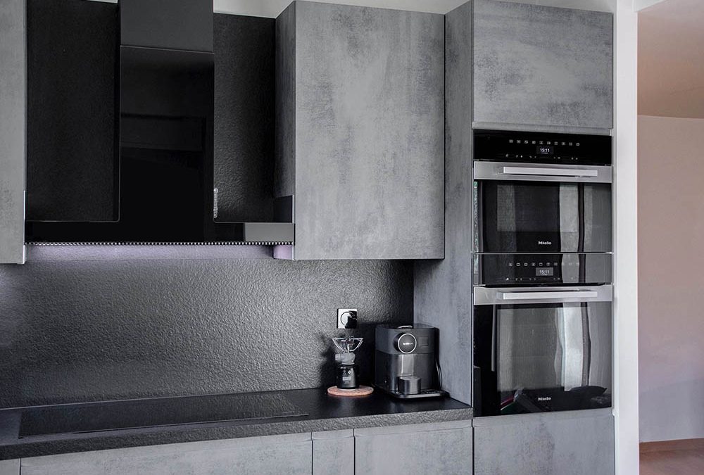 Gray kitchen with black granite counter